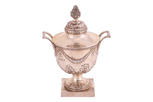 Lot 324 - A silver urn-shaped twin-handled cup with...