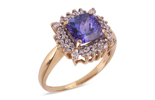 Lot 112 - A tanzanite and diamond cluster ring, the four-...