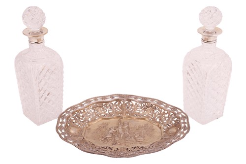 Lot 355 - A pair of silver-collared cut glass decanters,...