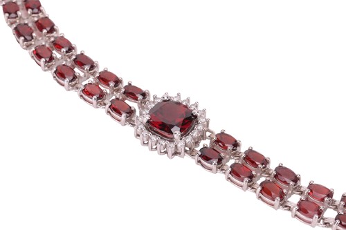 Lot 200 - A garnet and diamond collar necklace, composed...