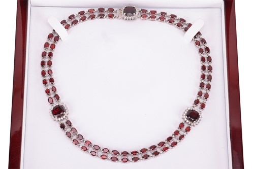 Lot 200 - A garnet and diamond collar necklace, composed...