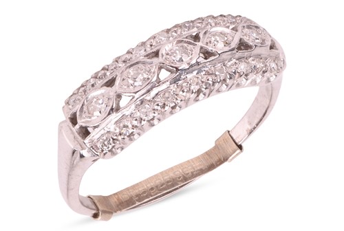 Lot 122 - A diamond set dress ring, featuring a central...