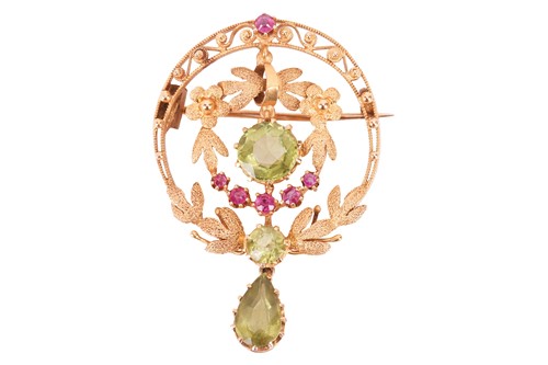 Lot 26 - A ruby and peridot brooch, of circular foliate...
