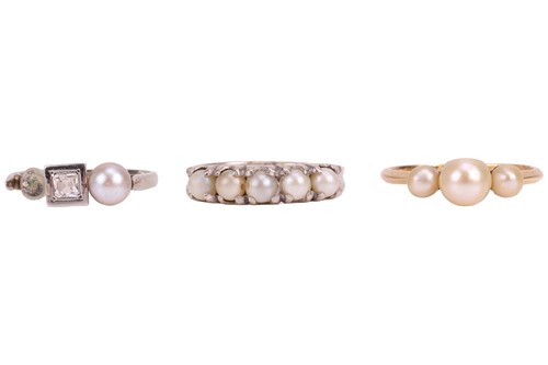 Lot 140 - Three pearl-set rings, including a three stone...