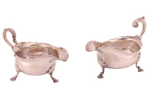 Lot 317 - Two George II silver sauce boats; first by...