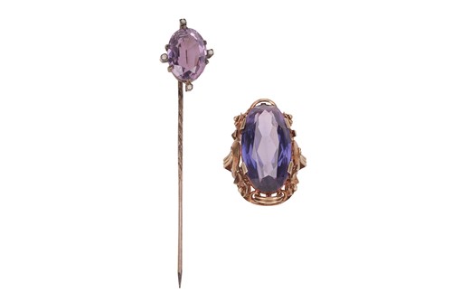 Lot 155 - A synthetic colour-changing sapphire cocktail...