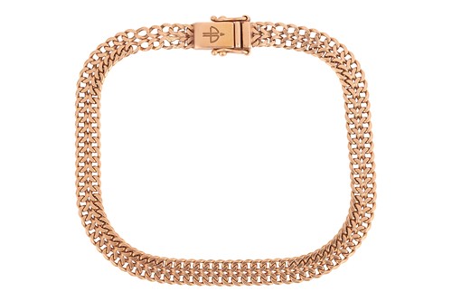 Lot 153 - A double-row curb link bracelet, completed...
