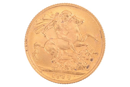 Lot 254 - A 1928 George V full sovereign, 8.0 grams.