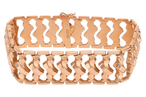 Lot 163 - An 18ct gold bracelet, consisting of wide...