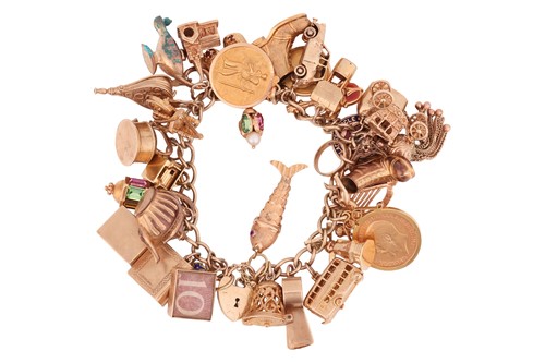 Lot 161 - A gold charm bracelet, including a 1911 half...