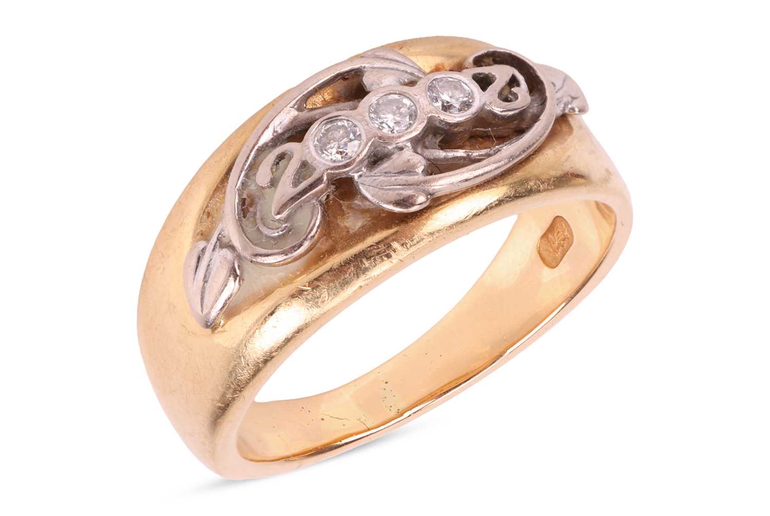 An 18ct "Millenium" ring by Clogau Gold, set with three round br