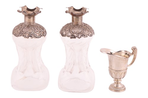 Lot 248 - A pair of Victorian silver-mounted ‘glug glug’...