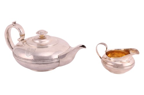 Lot 340 - A George III silver teapot and cream jug, by...