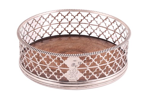 Lot 323 - A George III silver-mounted wine coaster,...
