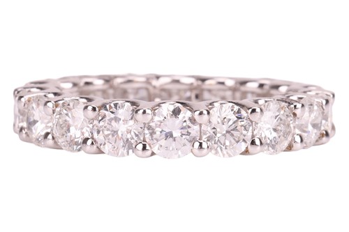 Lot 201 - A diamond eternity ring, composed of eighteen...