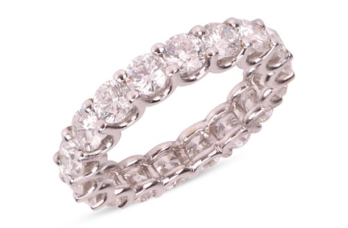 Lot 201 - A diamond eternity ring, composed of eighteen...