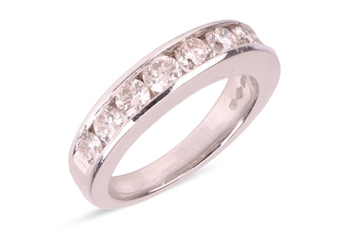 Lot 172 - A diamond half eternity ring, channel-set to...