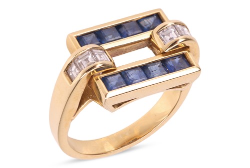 Lot 89 - A sapphire and diamond dress ring, the open...