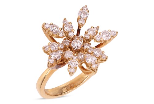 Lot 72 - A diamond set spray ring, featuring round...