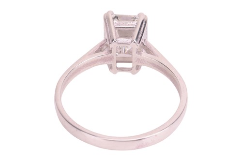 Lot 189 - An emerald-cut diamond solitaire ring,...