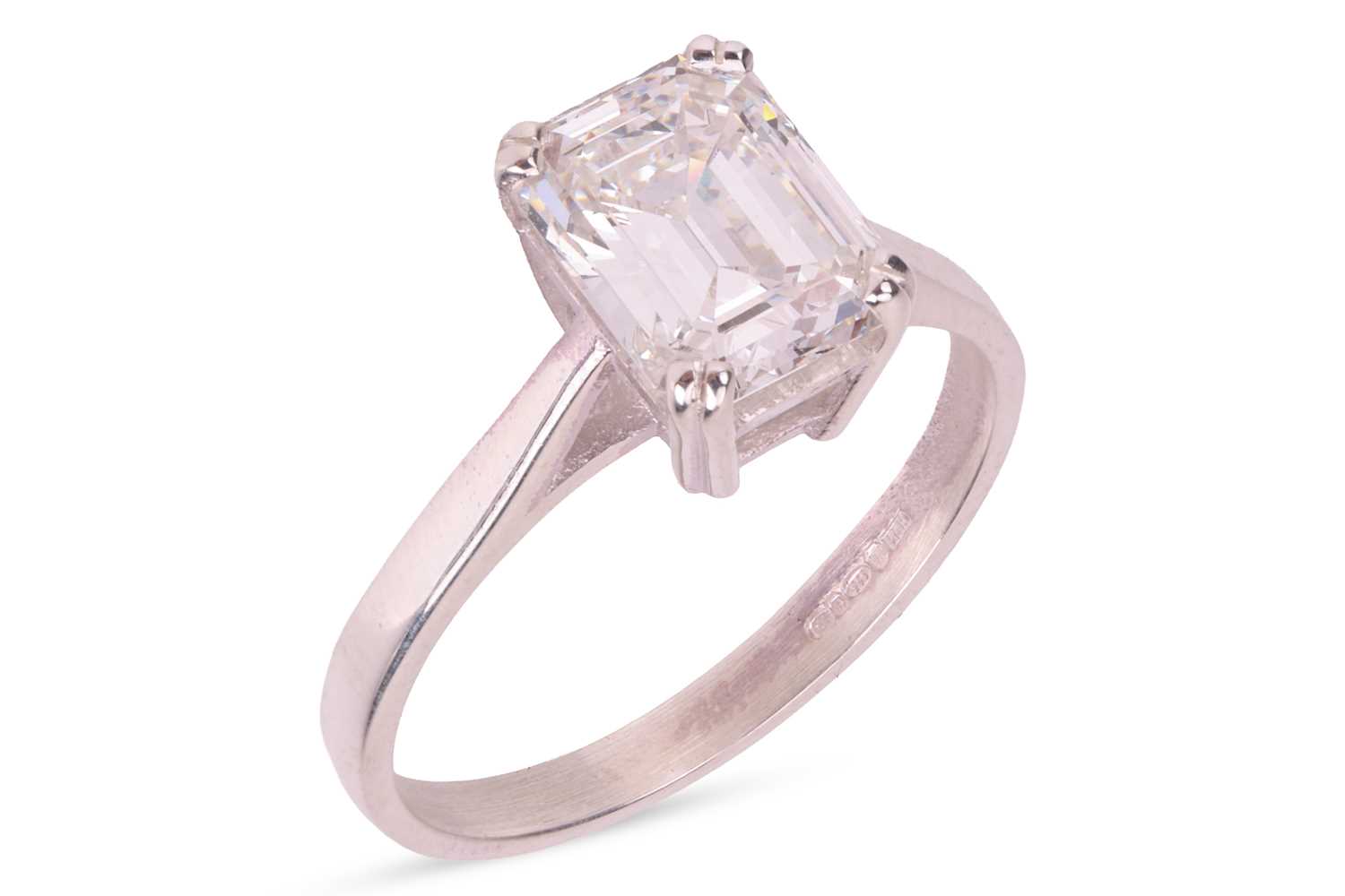 Lot 189 - An emerald-cut diamond solitaire ring,...