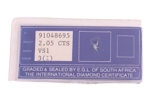 Lot 189 - An emerald-cut diamond solitaire ring,...
