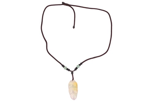 Lot 118 - A carved hardstone necklace, possible jadiete...