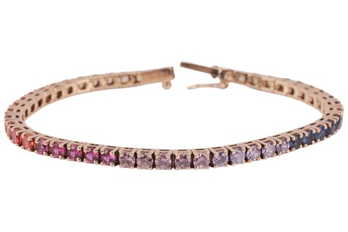 Lot 151 - A gem-set line bracelet, comprising synthetic...