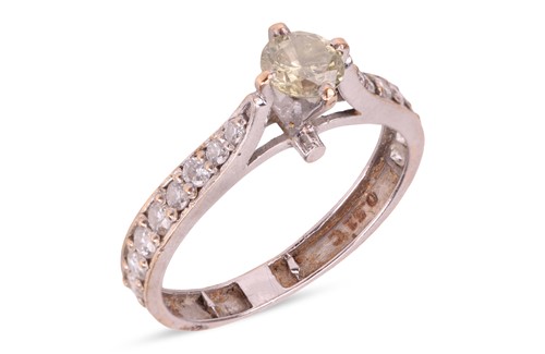 Lot 109 - A diamond ring, the central four-claw set...