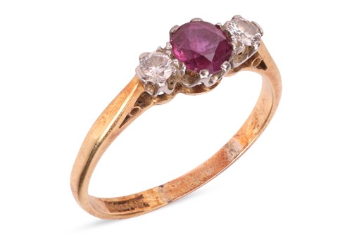 Lot 95 - A ruby and diamond three-stone ring, the...