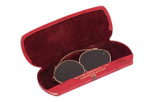 Lot 116 - An antique pair of gold clip-on glasses, with...