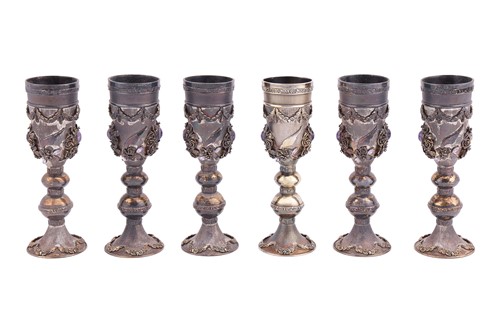 Lot 244 - A set of six silver-gilt kiddish cups, the...