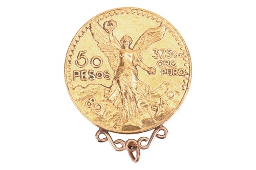 Lot 218 - A Mexican 50 Pesos coin with pendant...