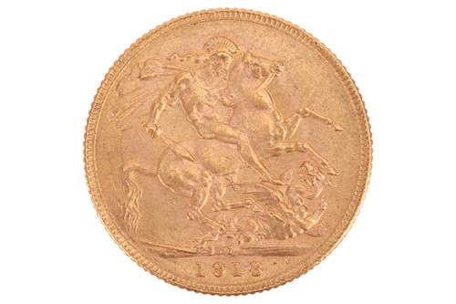 Lot 206 - A 1918 George V full sovereign, India mint,...