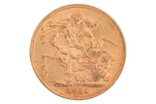 Lot 215 - A 1911 George V full sovereign coin, 8.0 grams.