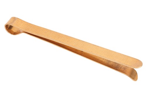 Lot 101 - A tie pin, with engraved surface design,...