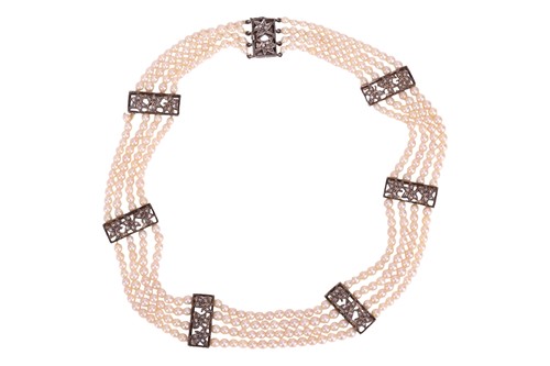 Lot 98 - A muli-strand pearl necklace with matching...