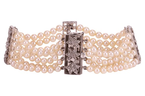 Lot 98 - A muli-strand pearl necklace with matching...