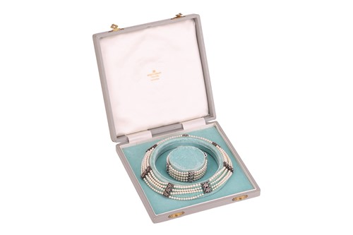 Lot 98 - A muli-strand pearl necklace with matching...
