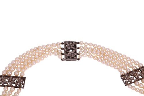 Lot 98 - A muli-strand pearl necklace with matching...