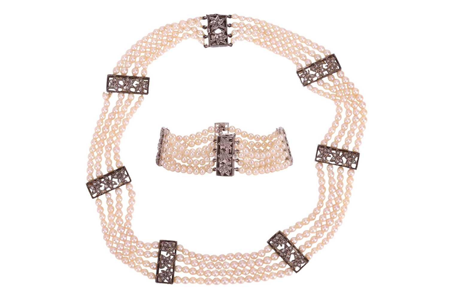Lot 98 - A muli-strand pearl necklace with matching...