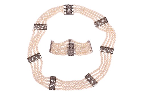 Lot 98 - A muli-strand pearl necklace with matching...