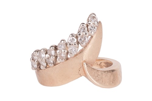 Lot 17 - A diamond-set dress ring, featuring a band of...