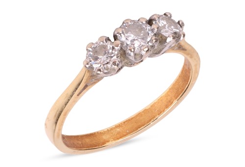 Lot 152 - A diamond-set three-stone ring, claw-set with...