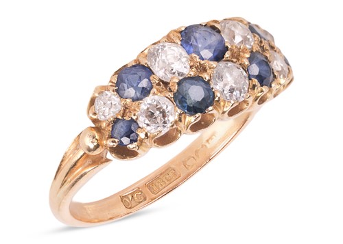 Lot 42 - A sapphire and diamond ring, featuring two...