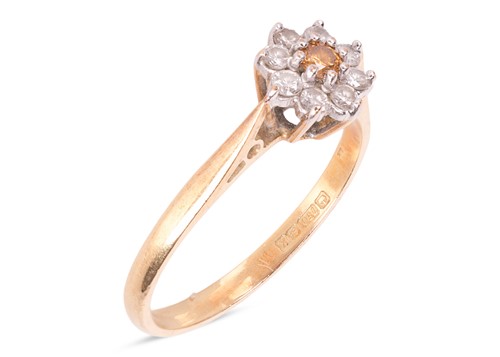 Lot 98 - A yellow diamond floral cluster ring, with a...