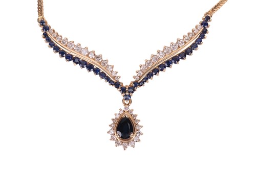 Lot 29 - A diamond and sapphire-set necklace, featuring...
