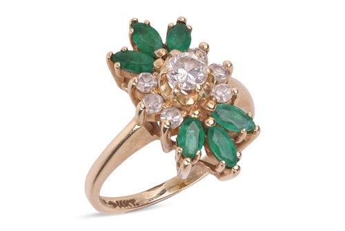 Lot 139 - An emerald and diamond cluster ring, featuring...