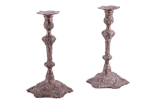 Lot 239 - A pair of George III silver cast candlesticks,...