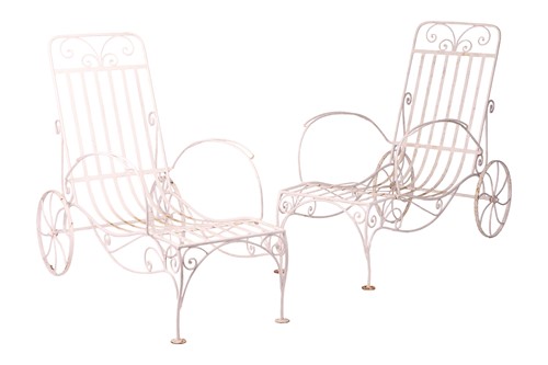 Lot 9 - A pair of wrought metal white-painted recliner...